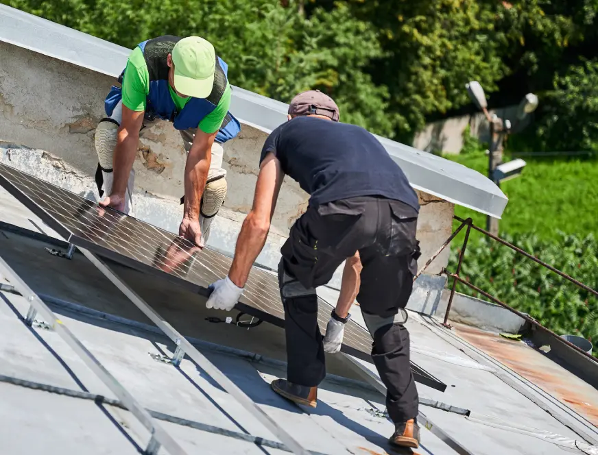 workers-building-solar-panel-system-on-roof-of-hou-2024-01-24-17-44-49-utc